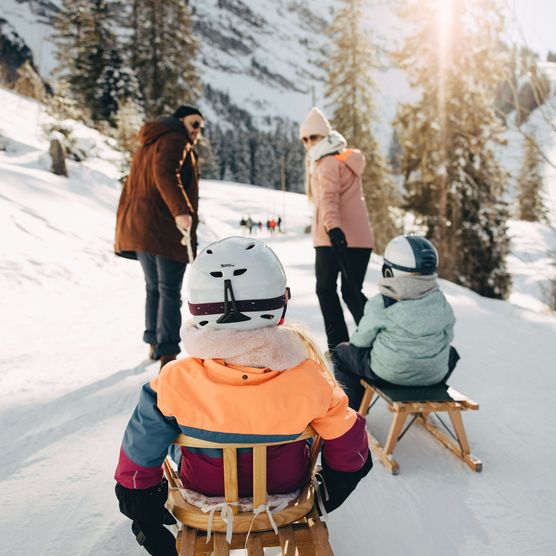 Picture Parents pulling children sitting on the sledge - to the picture